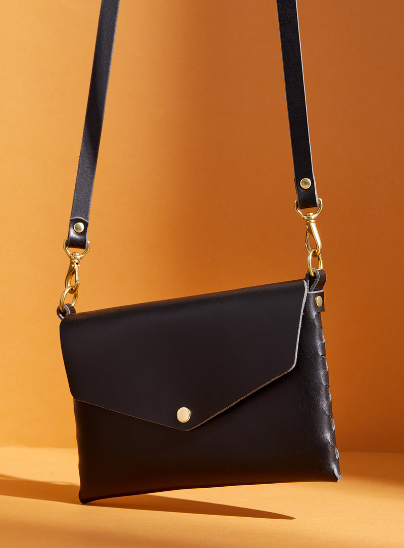 The modjūl mini leather bag in black. Handmade in Canada using quality Italian leather and brass hardware.