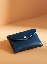modjūl's classic pouch in blue leather. A compact open wallet with endless possibilities, perfect for holding cards, keys or loose change. Handmade in Canada and joined with the signature modjūl joinery and quality brass hardware.