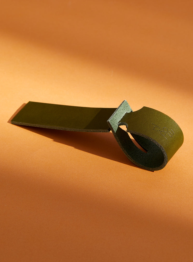 The modjūl leather traveller’s tag in olive. A luggage tag constructed using quality vegetable-dyed Italian leather with the option for personalization.