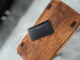 The short zip leather wallet in black designed and created by modjūl studio in Canada. Using quality leather this wallet can hold four cards and has a lined zip compartment.